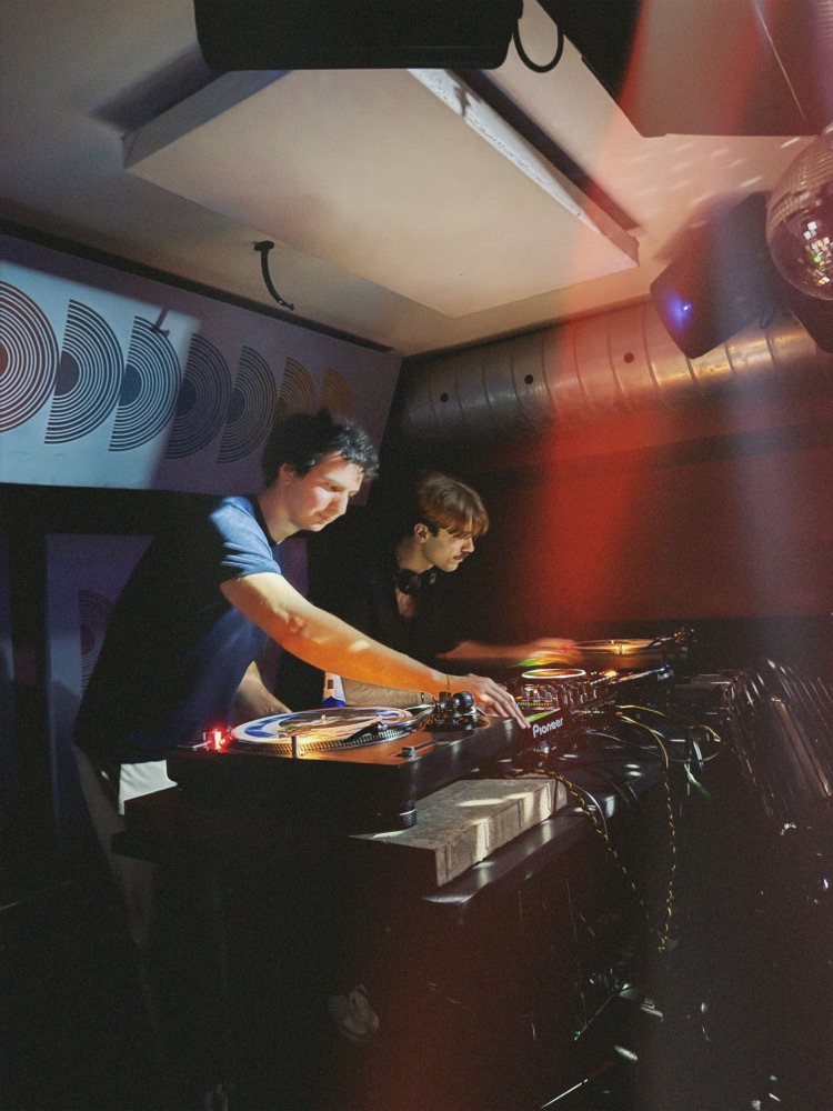 Behind the decks